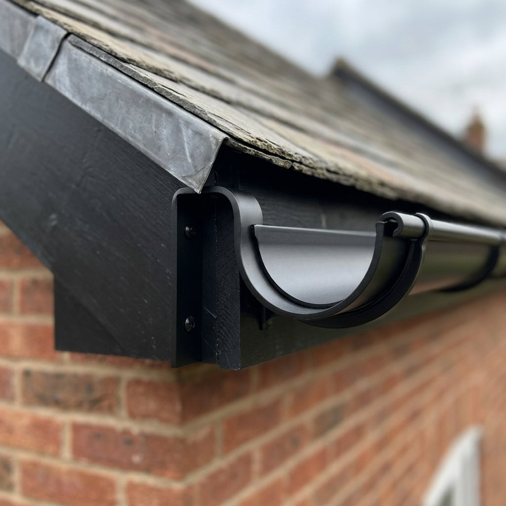 130mm Aluminium Gutter Top Rafter Bracket — RAL 9005 (in use)
