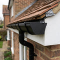 Moulded Ogee Gutter Right Hand Stop End 125 x 100mm — Textured Black (in use)